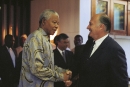 His Highness the Aga Khan greeting South African President Nelson Mandela in Mozambique, Maputo, 11 August 1998. 